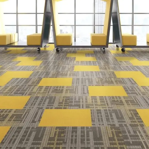 a yellow and grey carpeted room with yellow chairs